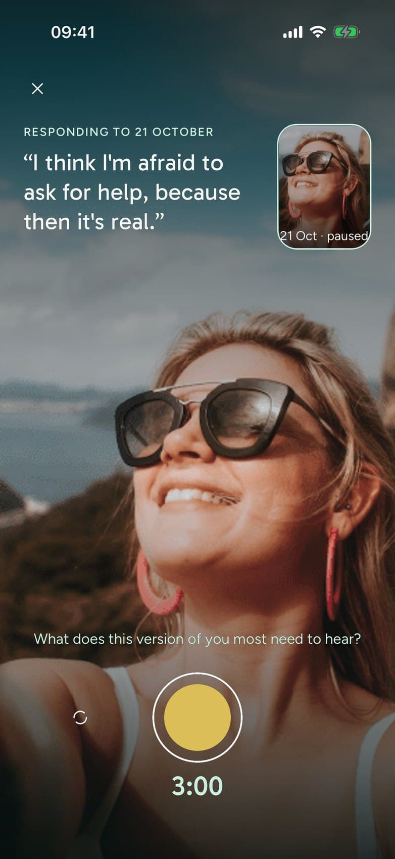 Responding in the INNATE app: a woman on camera answering her earlier self, whose entry is paused in the corner, under the line "I think I’m afraid to ask for help, because then it’s real."